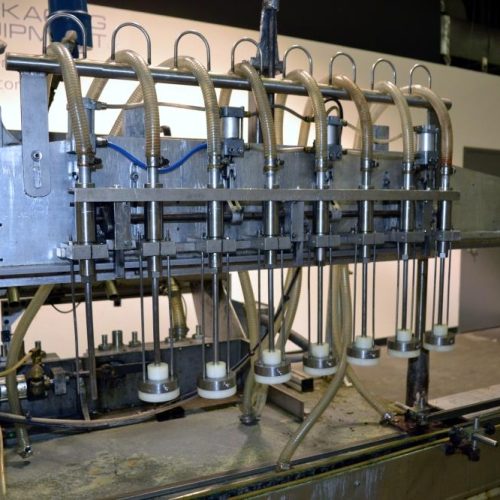 Cozzolli Model LF840 8 Head Inline Continuous Motion Walking Beam Style Piston Filler
