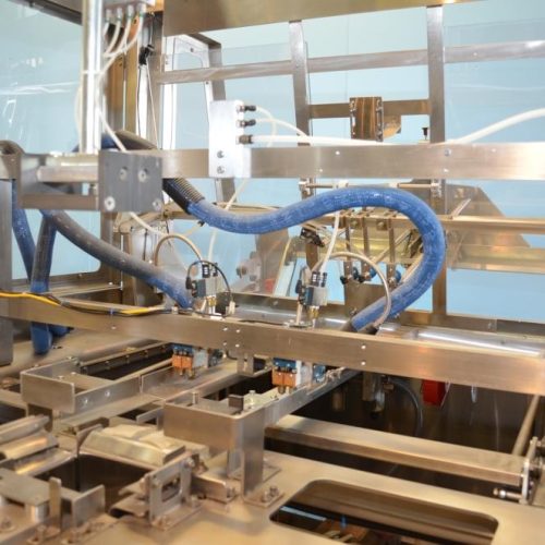 Adco Model AFCX351SS S/S 40 CPM Top Load Hot Melt Carton Erector and Conveyor