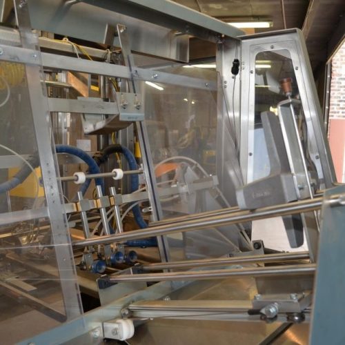 Adco Model AFCX351SS S/S 40 CPM Top Load Hot Melt Carton Erector and Conveyor