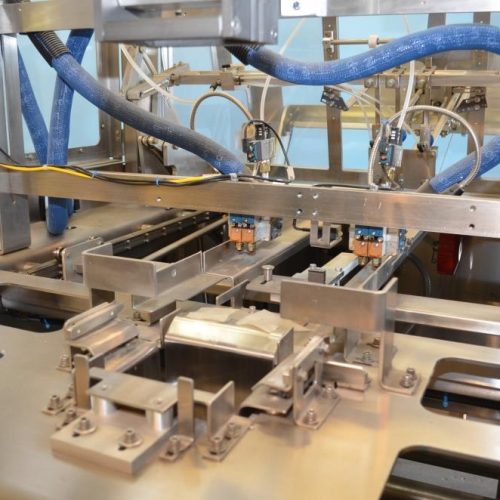 Adco Model AFCX351SS S/S 40 CPM Top Load Hot Melt Carton Erector and Conveyor