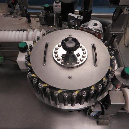 Neri Model RL500 Pressure Sensitive Wraparound Trunion Vial/Ampoule Labeler