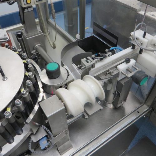 Neri Model RL500 Pressure Sensitive Wraparound Trunion Vial/Ampoule Labeler