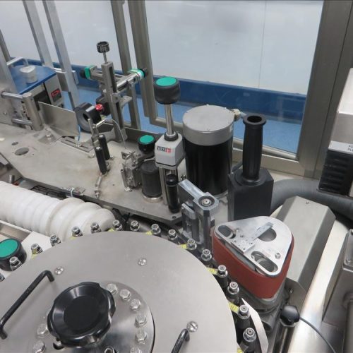 Neri Model RL500 Pressure Sensitive Wraparound Trunion Vial/Ampoule Labeler