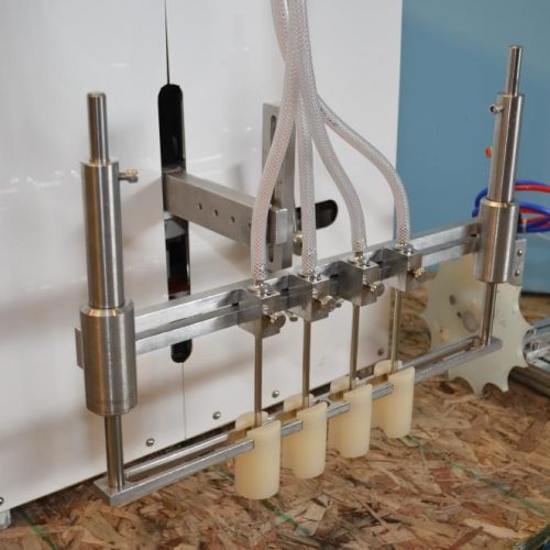 Filamatic Model DAB100 (4) Head Bench Top Inline Piston Filler with 12 Pumps