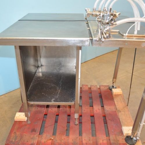 Filamatic Model DAB100 (4) Head Bench Top Inline Piston Filler with 12 Pumps