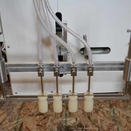 Filamatic Model DAB100 (4) Head Bench Top Inline Piston Filler with 12 Pumps