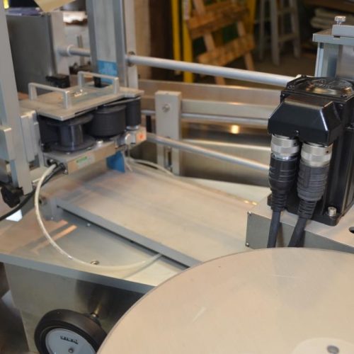 NJM CLI Model UNI300VAS034 S/S 140 CPM Pressure Sensitive Wraparound Labeler
