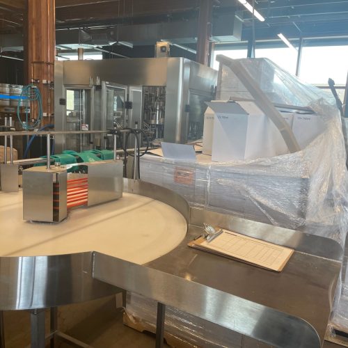 Norland Model GlassPak33 (12) Head Monoblock Rotary Bottle Filling Line with Capper