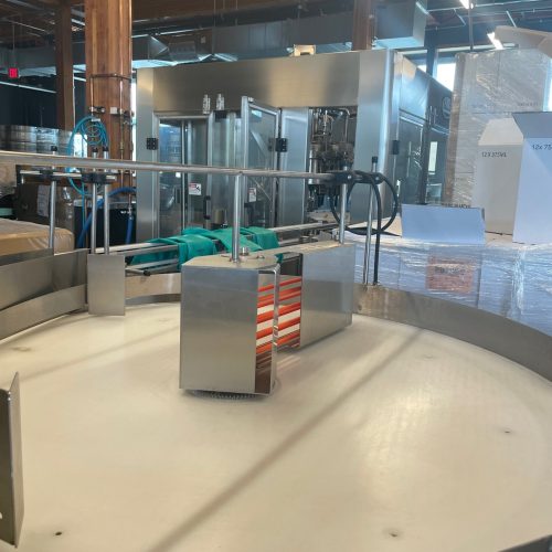 Norland Model GlassPak33 (12) Head Monoblock Rotary Bottle Filling Line with Capper