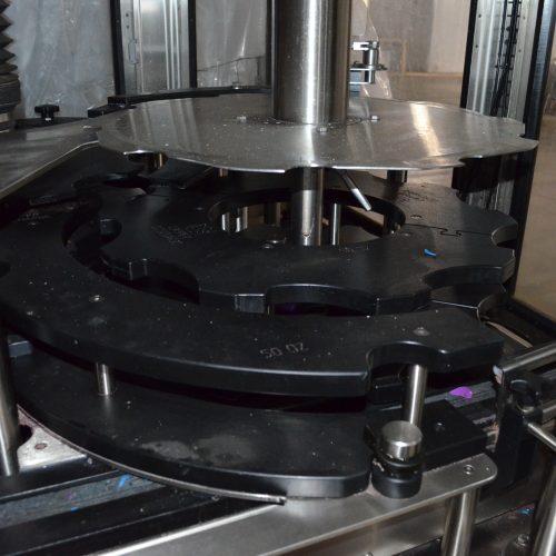 US Bottlers Model FM3078 / RC1026 Monoblock 200 BPM Rotary Filler and Capper with Cap Sorter