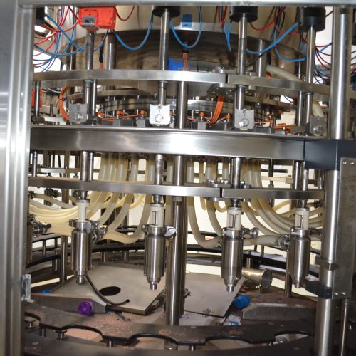 US Bottlers Model FM3078 / RC1026 Monoblock 200 BPM Rotary Filler and Capper with Cap Sorter