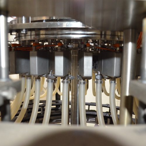 US Bottlers Model FM3078 / RC1026 Monoblock 200 BPM Rotary Filler and Capper with Cap Sorter