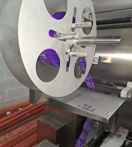 SleeveSeal Model SSL100 Stainless Steel High-Performance Vertical Sleeve Labeler