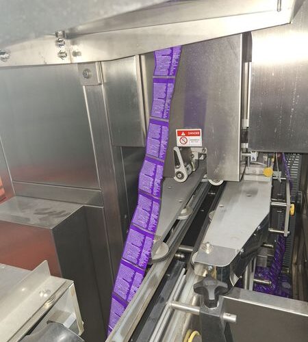 SleeveSeal Model SSL100 Stainless Steel High-Performance Vertical Sleeve Labeler